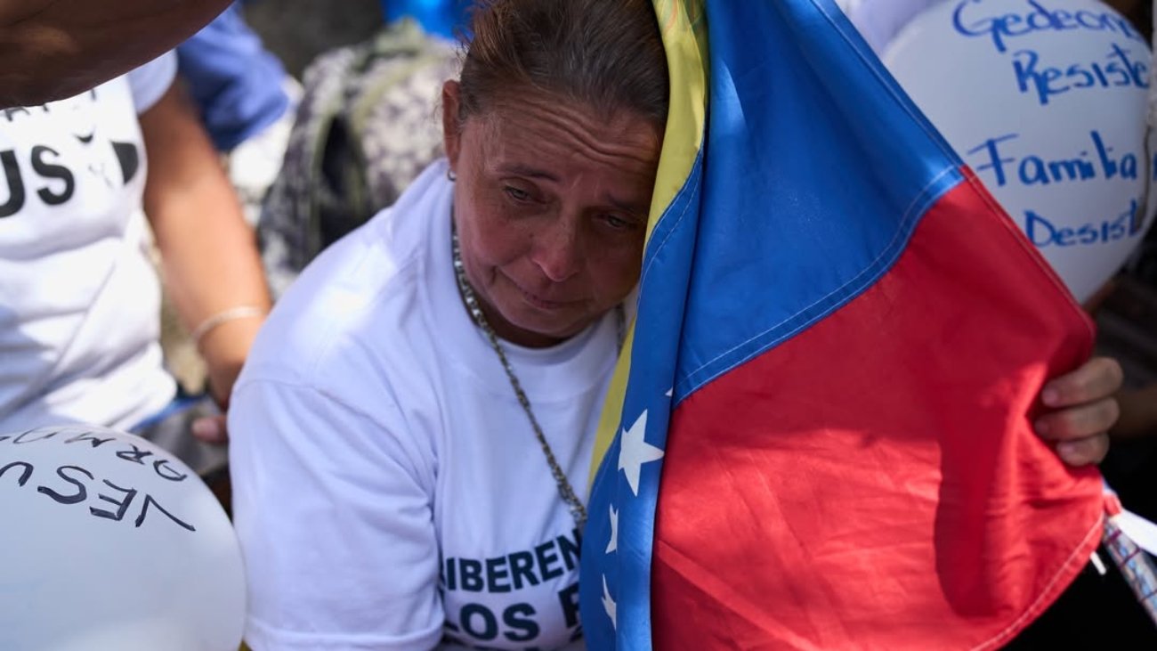 Relatives of they consider political prisoners attend a prayer for freedom, peace and reconciliation close of the Helicoide a detention center in Caracas, Venezuela, Saturday, Feb. 7, 2026. (AP Photo/Ariana Cubillos)