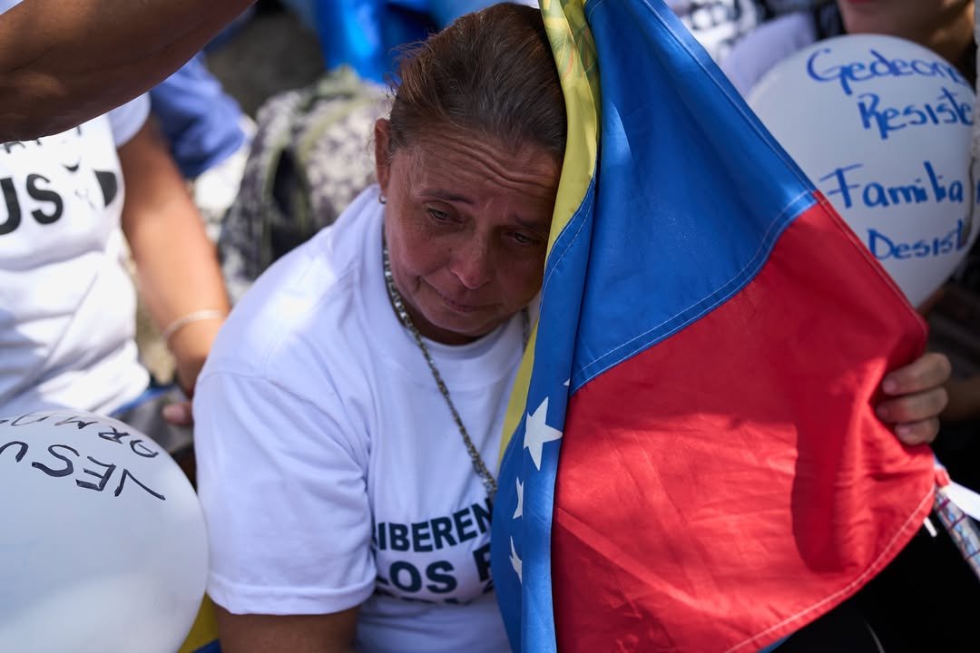 Relatives of they consider political prisoners attend a prayer for freedom, peace and reconciliation close of the Helicoide a detention center in Caracas, Venezuela, Saturday, Feb. 7, 2026. (AP Photo/Ariana Cubillos)